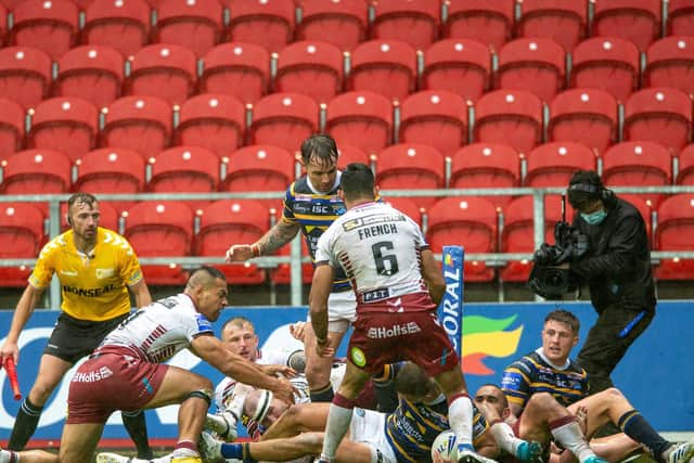 Leeds Rhinos' Ash Handley scores his second try to leave Wigan Warriors grounded (PIC: BRUCE ROLLINSON)