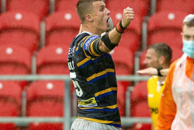 Very handy: Ash Handley celebrates his second try for Rhinos.
 Picture Bruce Rollinson