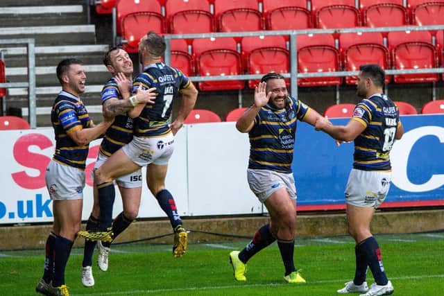 Happy days: Tom Briscoe celebrates scoring the Rhinos third try.
  Picture Bruce Rollinson