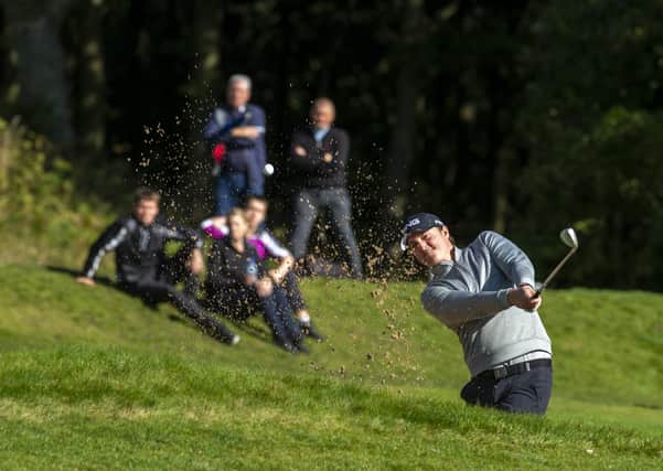 Splashing out: Nick McCarthy plays a shot out of a bunker at Huddersfield as he held on to his 2020protour title. (Picture: Bruce Rollinson)