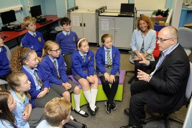 Robert Halfon is a Conservative MP and chair of Parliament’s Education Committee. He is pictured talking to a group of pupils.