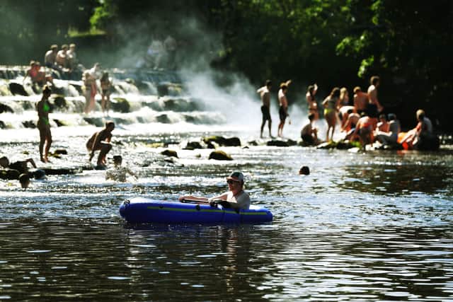 Crowds gathered in Burley-in-Wharfedale in late June as people headed to the River Wharfe.