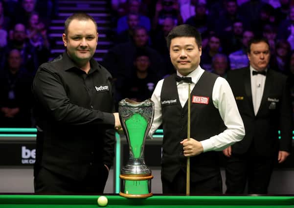Stephen Maguire and Ding Junhui handshake before the final  of last year's UK Championship at the York Barbican. PA Photo. Picture: Richard Sellers/PA
