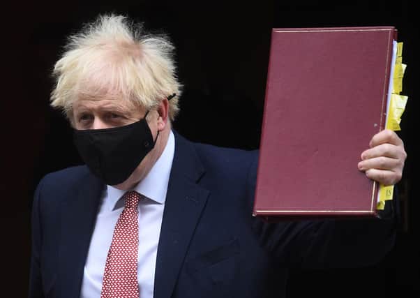 Boris Johnson leaves 10 Downing Street for Prime Minister's Questions.