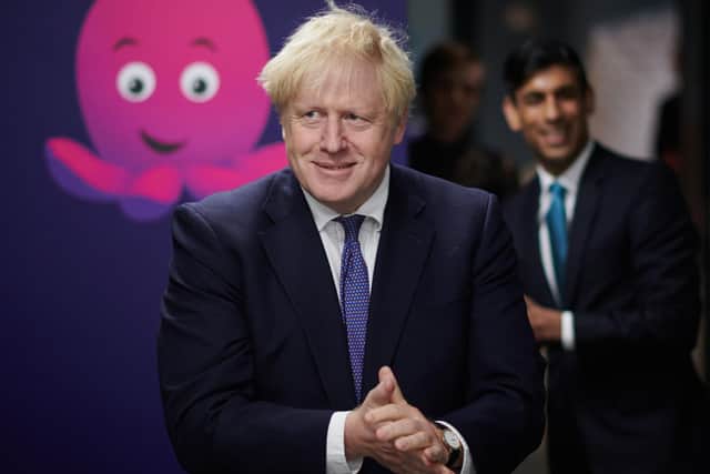 Prime Minister Boris Johnson and Chancellor of the Exchequer Rishi Sunak during a visit to the headquarters of Octopus Energy in London.