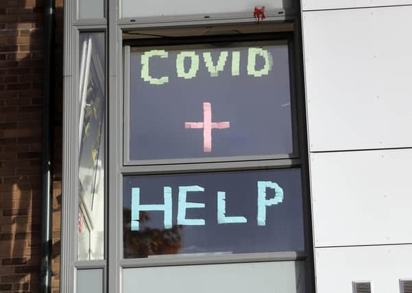 A sign in the window of the student accommodation at an university in lockdown.