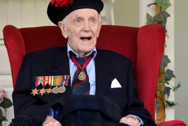 Henry McKenzie Johnston a 99 year old veteran of WW2 at the Greenwell Nursing Home in Bedale , watches Stephen Beattie a Piper with the Black Watch Association Pipe Band from Stoke on Trent playing the pipes. Image Gary Longbottom.