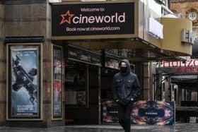 A man walks past the Cineworld cinema in Leicester Square on October 05, 2020 in London.  (Photo by Dan Kitwood/Getty Images)