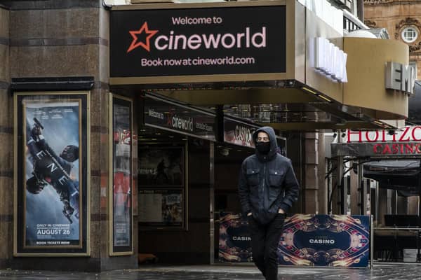 A man walks past the Cineworld cinema in Leicester Square on October 05, 2020 in London.  (Photo by Dan Kitwood/Getty Images)