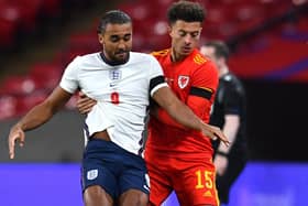 England's Dominic Calvert-Lewin (left) and Wales' Ethan Ampadu battle for the ball (Picture: PA)