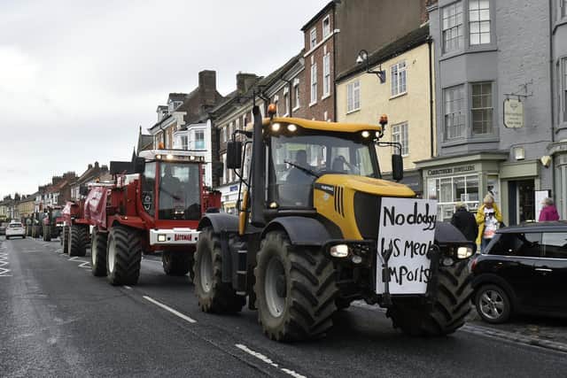 Around 20 farm vehicles drove in convoy up the Main Street