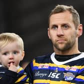 Warrior: 
Rob Burrow on the pitch with his son Jackson.
Picture: Jonathan Gawthorpe