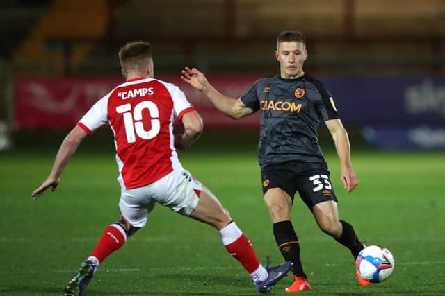 Fleetwood Town's Callum Camps (left) and Hull City's Greg Docherty battle for the ball.