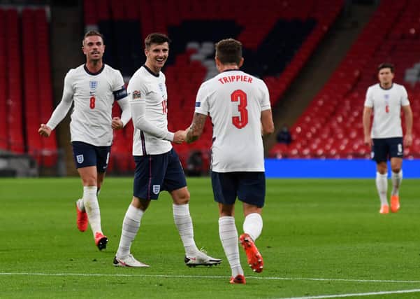 England’s Mason Mount celebrates his winner with team-mates to secure a 2-1 win over Belgium in the UEFA Nations League group stage match at Wembley Stadium. Picture: Neil Hall - Pool/Getty Images