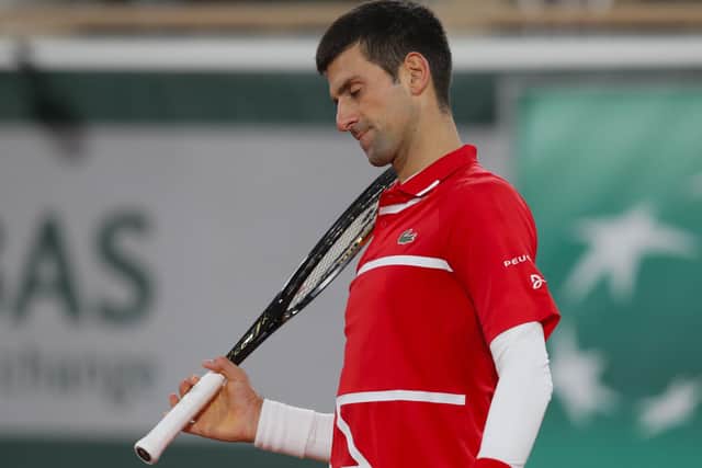 Forlorn: Serbia's Novak Djokovic reacts after missing a shot in his straight sets defeat against Spain's Rafael Nadal in Paris.  (AP Photo/Michel Euler)