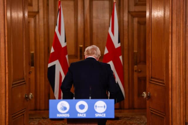 Prime Minister Boris Johnson leaves following a media briefing in Downing Street, London, on coronavirus.