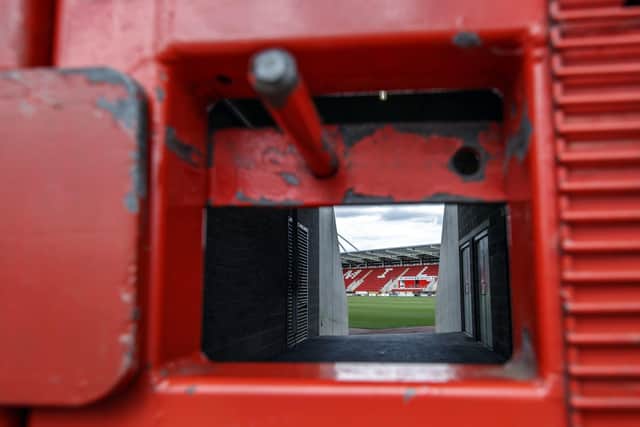 A veiw through a locked gate at the AESSEAL New York Stadium.