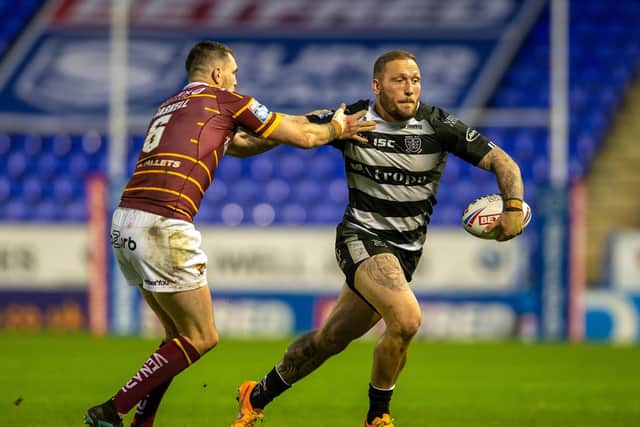 Hull FC's Josh Griffin goes past Lee Gaskell (BRUCE ROLLINSON)
