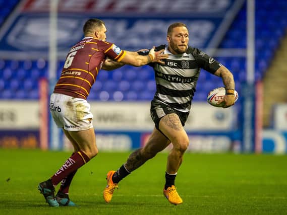 Hull FC's Josh Griffin goes past Lee Gaskell (BRUCE ROLLINSON)