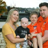 Baby Loss Awareness Week.To help with his grief Alex Walmsley set up SANDS United Huddersfield,  a football team of dads and other family members affected by baby loss.Pictured with wife Olivia and Toby (7 months) and Isaac (7).Picture : Jonathan Gawthorpe