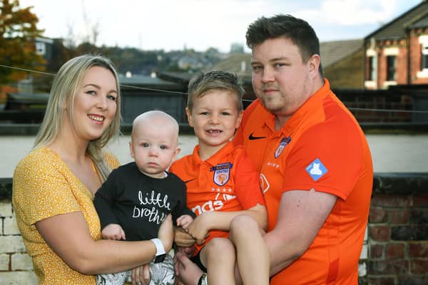 Baby Loss Awareness Week.To help with his grief Alex Walmsley set up SANDS United Huddersfield,  a football team of dads and other family members affected by baby loss.Pictured with wife Olivia and Toby (7 months) and Isaac (7).Picture : Jonathan Gawthorpe
