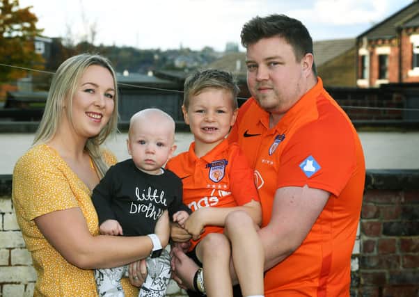 Baby Loss Awareness Week.
To help with his grief Alex Walmsley set up SANDS United Huddersfield,  a football team of dads and other family members affected by baby loss.
Pictured with wife Olivia and Toby (7 months) and Isaac (7).
Picture : Jonathan Gawthorpe