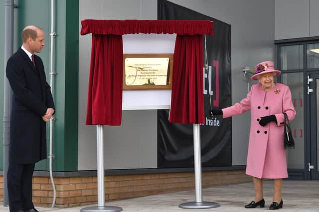 The Duke of Cambridge watches as Queen Elizabeth II unveils a plaque to officially open the new Energetics Analysis Centre at the Defence Science and Technology Laboratory (DSTL) at Porton Down, Wiltshire.