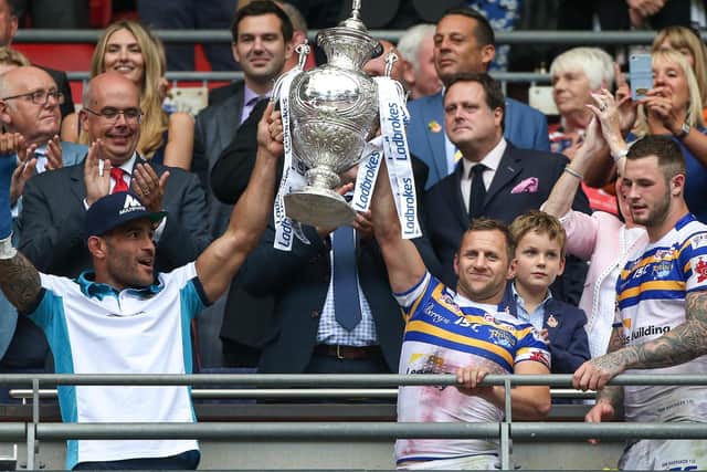 Leeds Rhinos' Rob Burrow, right, lifts the Challenge Cup with Paul Aiton in 2015.
(Alex Whitehead/SWpix.com)