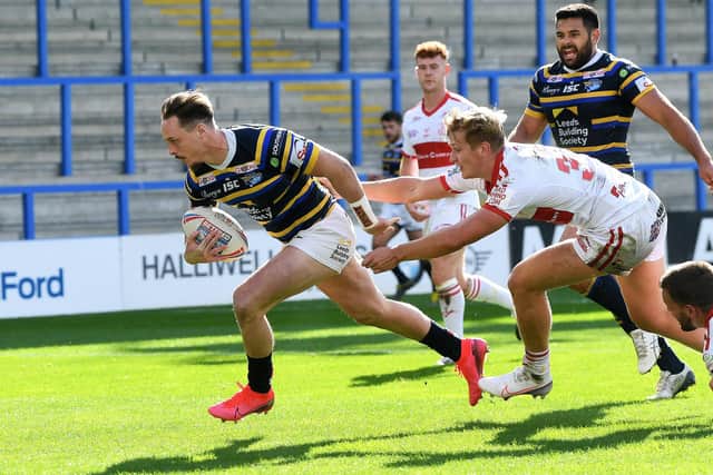 Leeds Rhinos' James Donaldson gets away from Rovers' William Tate (Picture: Jonathan Gawthorpe)