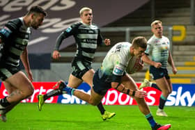 Leeds Rhinos' Ash Handley goes over for one of his three tries against Hull FC (BRUCE ROLLINSON)