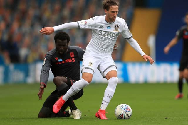 Leeds United's Barry Douglas and Stoke City's Mame Biram Diouf (left) battle for the ball during the Sky Bet Championship match at Elland Road, Leeds. (Picture: PA)
