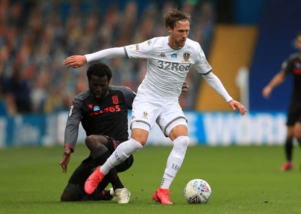 Leeds United's Barry Douglas and Stoke City's Mame Biram Diouf (left) battle for the ball during the Sky Bet Championship match at Elland Road, Leeds. (Picture: PA)