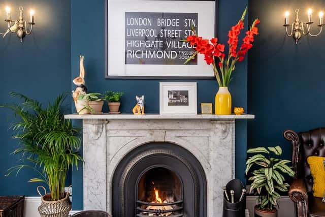 Amanda and Frank's sitting room with Farrow and Ball's Haugue Blue on the wall and, left, a soft sculpture by Mister Finch. (James Hardisty).