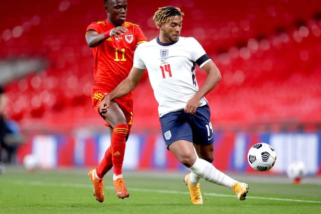 Wales' Rabbi Matondo (left) and England's Reece James battle for the ball (Picture: PA)