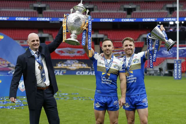 Victory spoils: Luke Gale, left, celebrates with the Challenge Cup and coach Richard Agar (left) and Lance Todd Trophy winner Richie Myler. Picture: Ed Sykes/SWpix.com