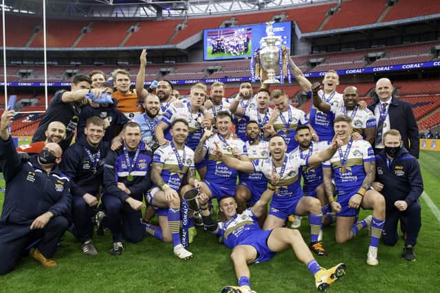 Party time: The Leeds Rhinos squad celebrate their win over Salford Red Devils. Picture by Allan McKenzie/SWpix.com - 17/10/2020
