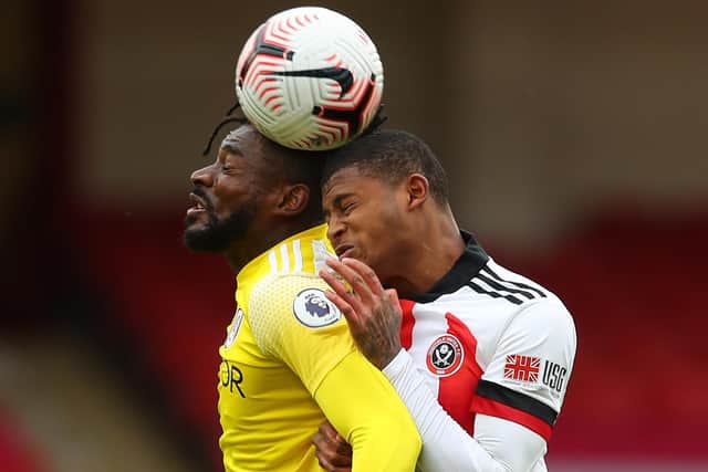 Rhian Brewster of Sheffield Utd on his debut challenges Fulham's Andre Frank Anguissa.