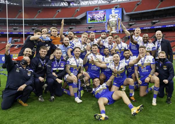 Job done: Leeds Rhinos players and officials celebrate their Wembley victory. Picture: Allan McKenzie/SWpix.com