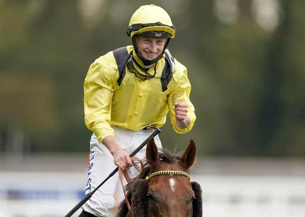 Tom Marquand celebrates the Champion Stakes success of Addeybb.