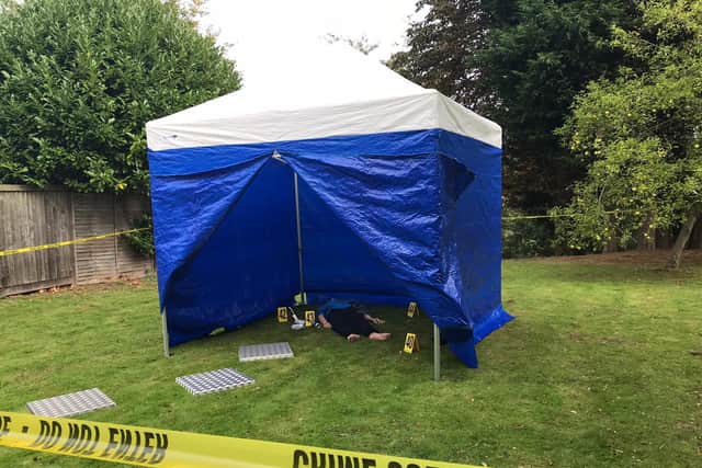 A mannequin lies inside a police tent at a new CSI training centre in Wetherby simulating real life crime scenes