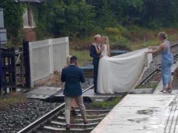 The bridal party picture posing on the tracks near Whitby