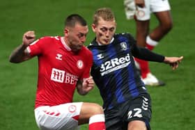 Bristol City's Jack Hunt (left) and Middlesbrough's George Saville battle for the ball. Picture: PA
