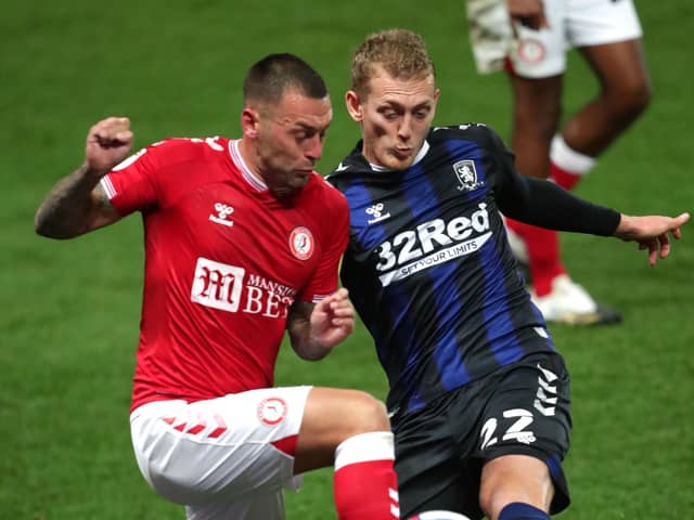 Bristol City's Jack Hunt (left) and Middlesbrough's George Saville battle for the ball. Picture: PA