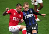 Bristol City's Jack Hunt (left) and Middlesbrough's George Saville battle for the ball. Picture: PA