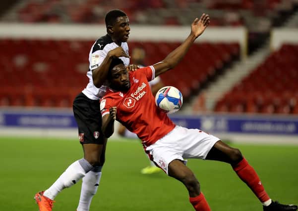 Notingham Forest's Sammy Ameobi and Rotherham's Wes Harding battle for the ball (Picture: PA)