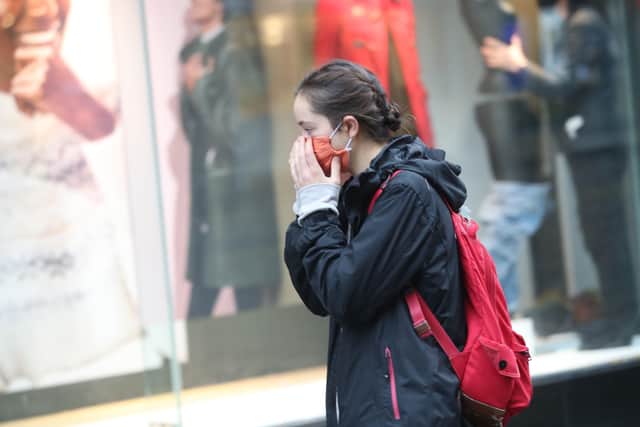 A woman wearing a face mask in Sheffield city centre, as South Yorkshire is the latest region to be placed into Tier 3 coronavirus restrictions, which will come into effect on Saturday.