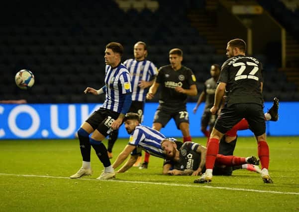 FIGHTING TALK: Sheffield Wednesday's Callum Paterson equalises with a header against Brentford on Wednesday night. Picture: Steve Ellis