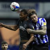 Brentford's Ethan Pinnock and Sheffield Wednesday's Aden Flint. Picture: PA.