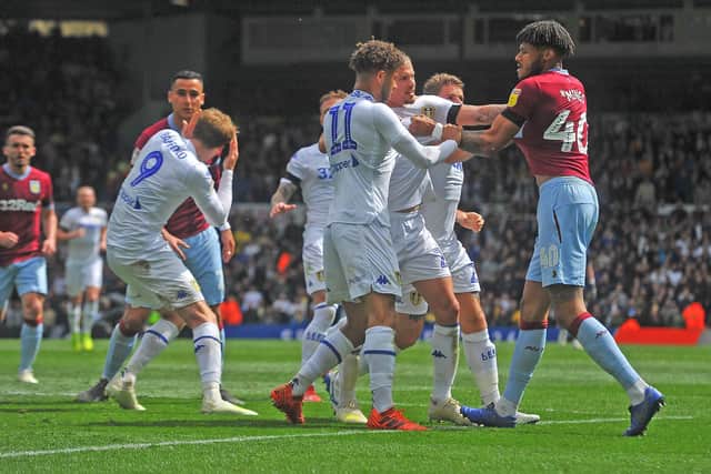 FLASHPOINT: Patrick Bamford goes down challenged by Villa's Anwar El Ghazi as tempers boil over after Mateusz Klich's goal at Elland Road in April 2019. Picture:Tony Johnson.