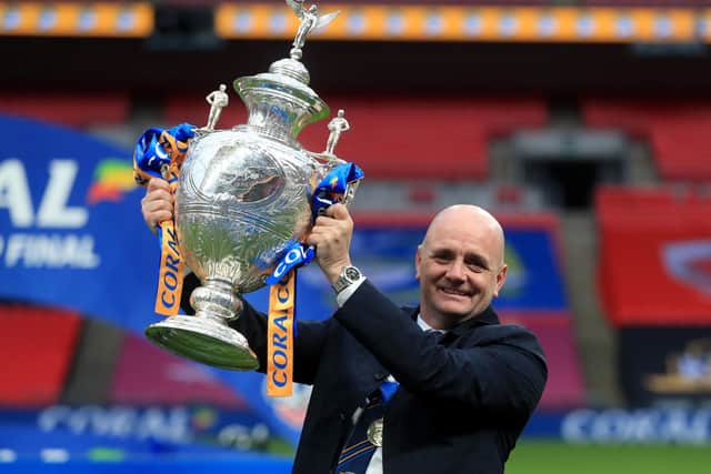 Leeds Rhinos head coach Richard Agar poses with the Challenge Cup trophy. Picture: PA